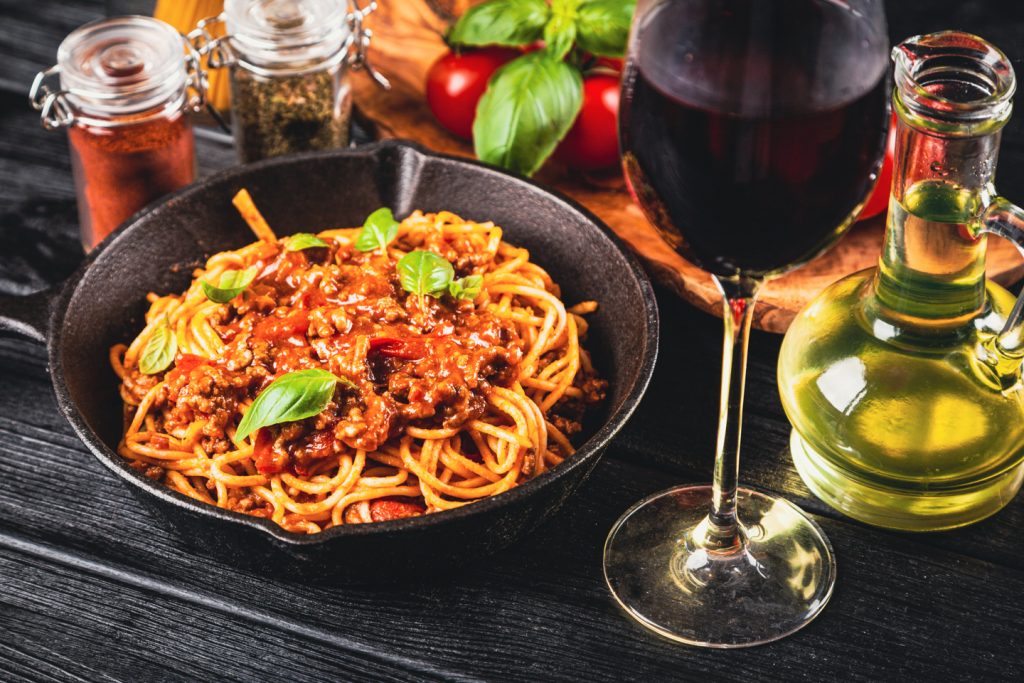 spagetti bolognese and red wine glass